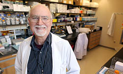Robert Gemmill stands in his lab